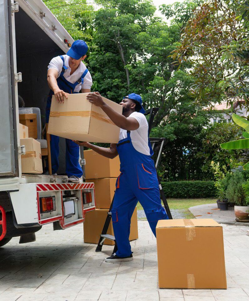 Movers loading boxes onto a truck.